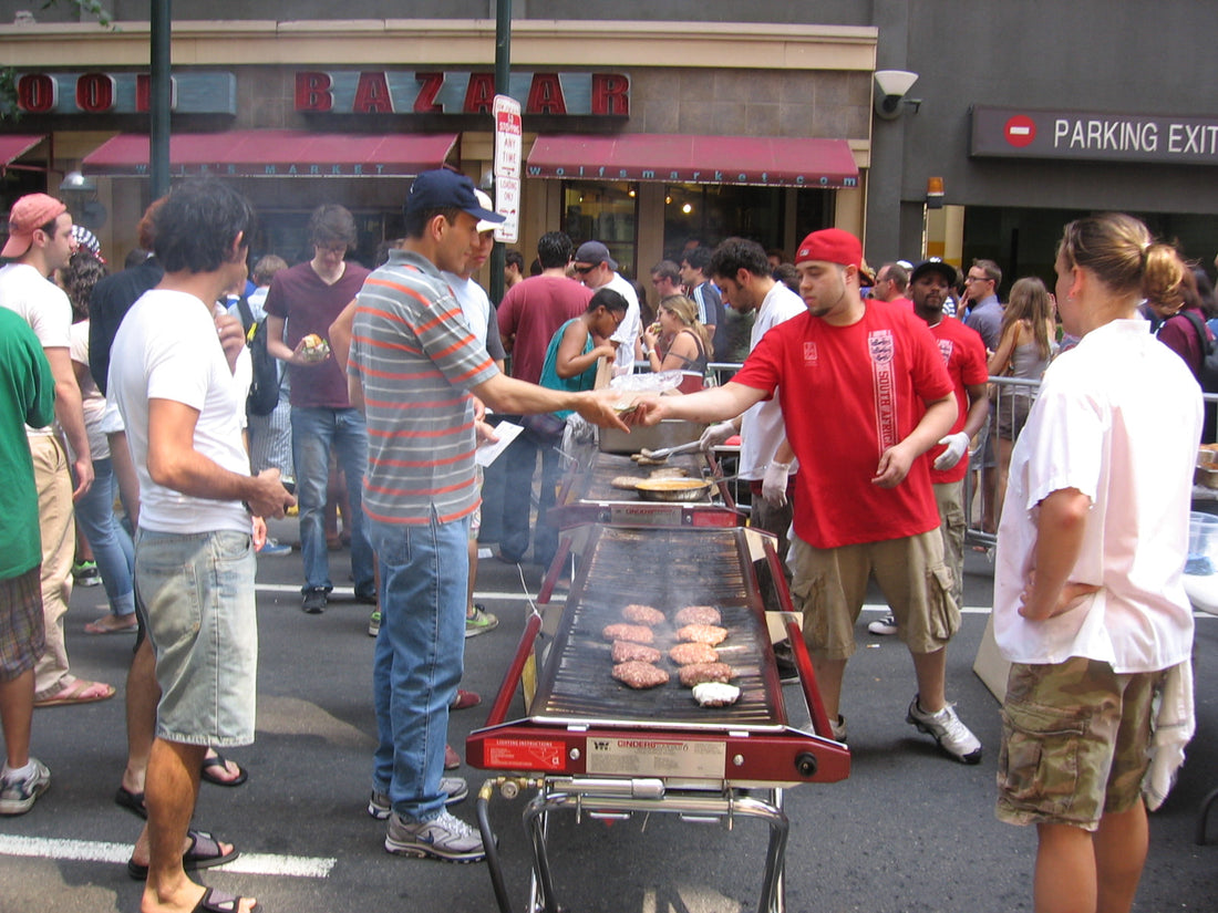 commercial barbecue street food serving and crowd