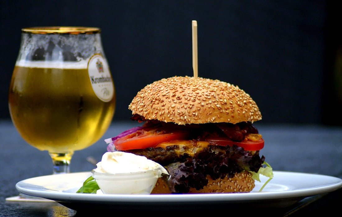 beer and burger with bap on a plate