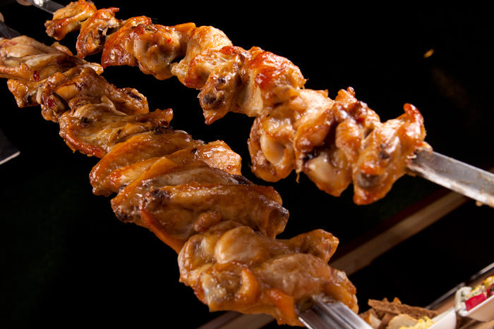 Brazilian chicken on kebab skewers