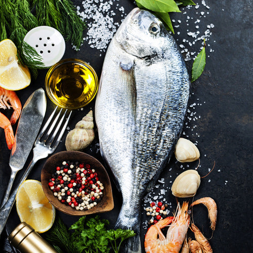 big fish and seasoning with oil and shrimps