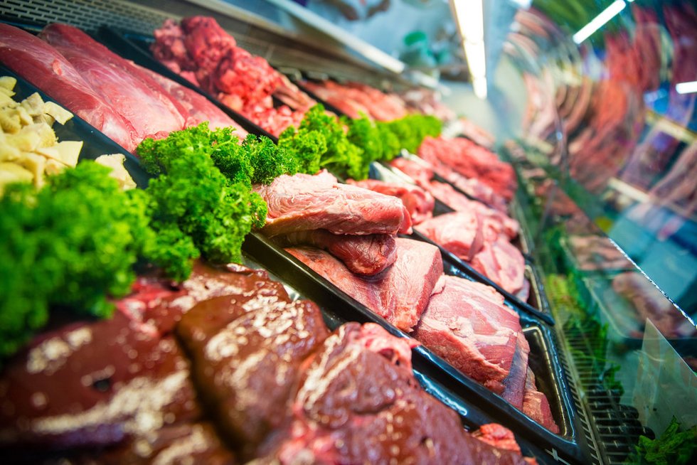beef on a counter under display glass