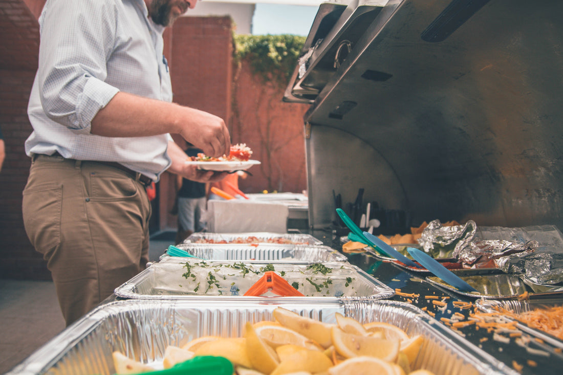 Man serving himself from a catering truck.