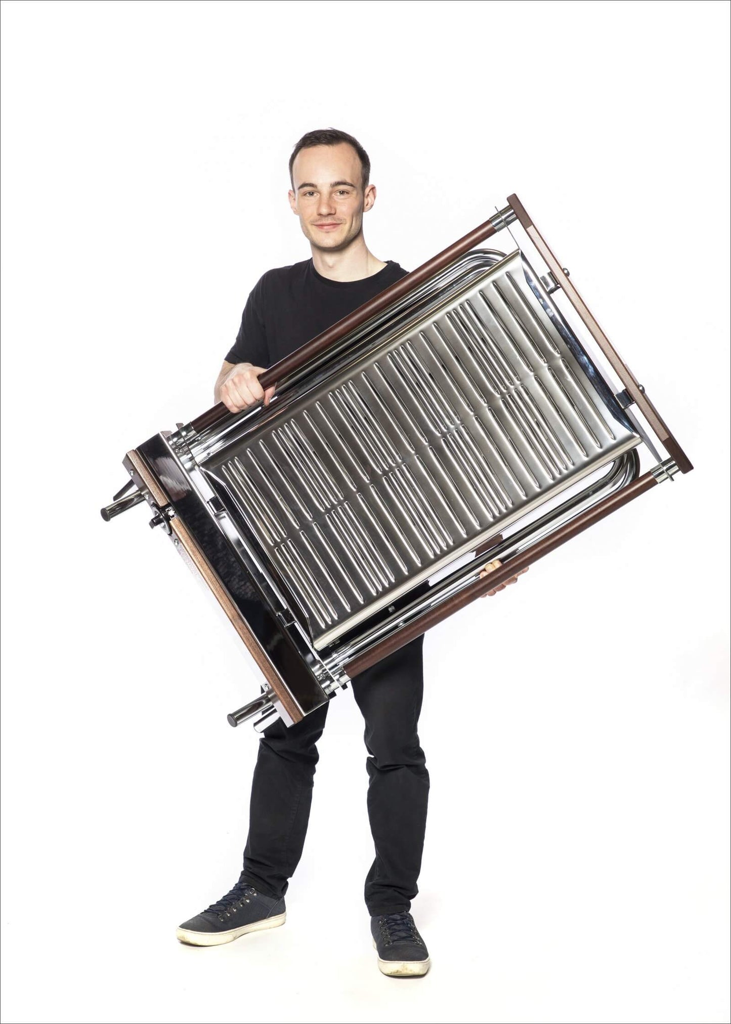 Cinders SG80F BBQ grill being lifted for transport