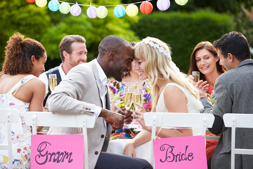 Bride and Groom at a wedding with friends