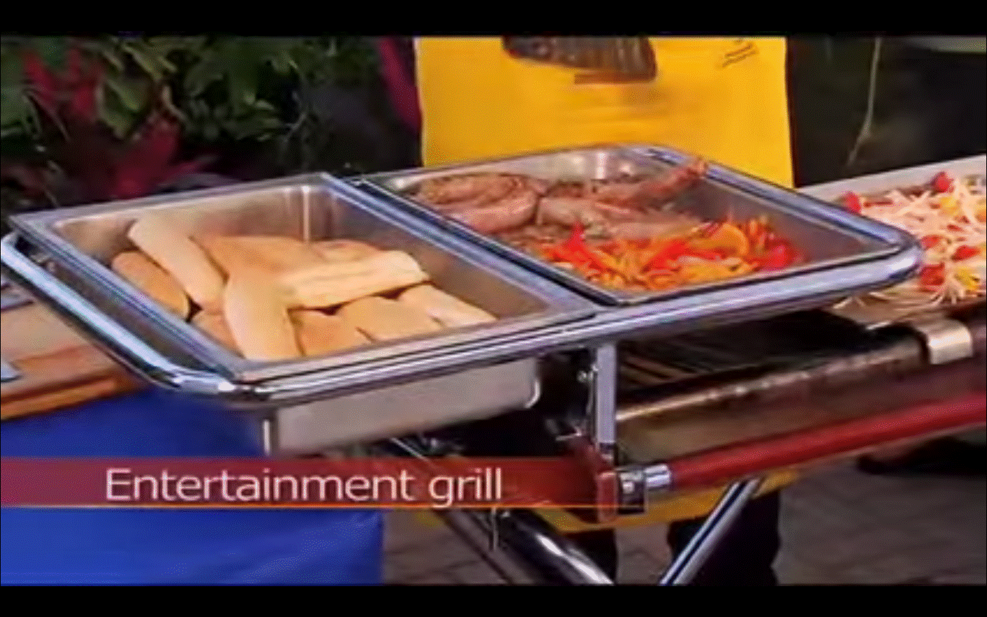 BBQ pan support holding food on Cinders grill