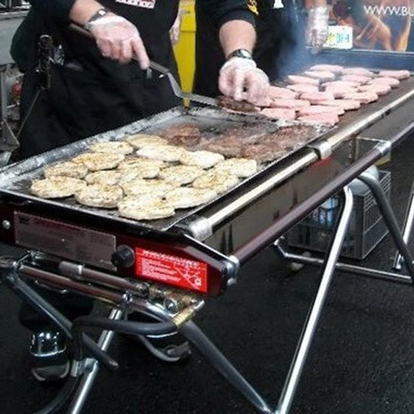 People enjoying food cooked on Cinders BBQ
