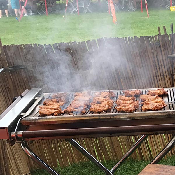 Outdoor barbecue event using Cinders BBQ grill