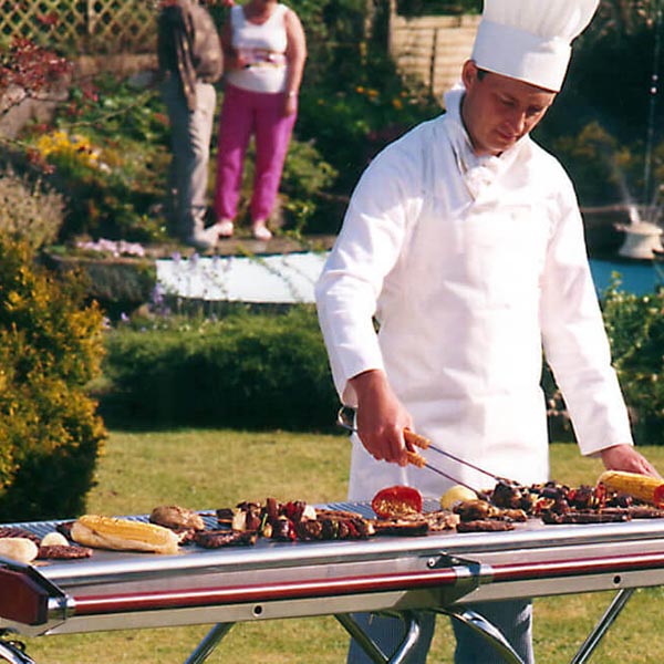 Professional outdoor BBQ setup with Cinders grill