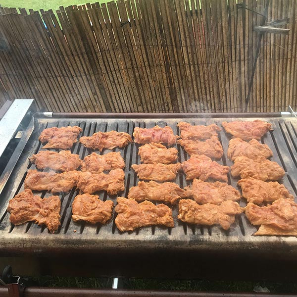 Premium Cinders barbecue grill at outdoor event